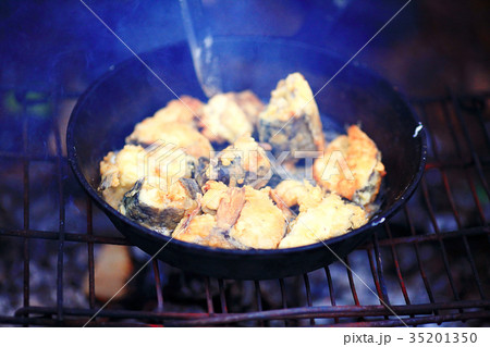 Fried fish on a pan bonfire Fried fish on a pan bonfire 35201350
