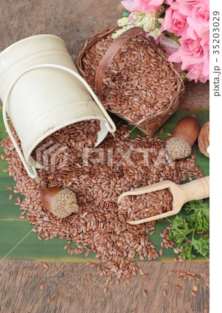 flax seeds for health on wood background 35203029