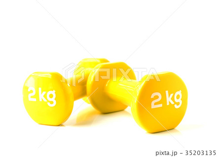 Light yellow dumbbell weight in white background Light yellow dumbbell weight in white background 35203135