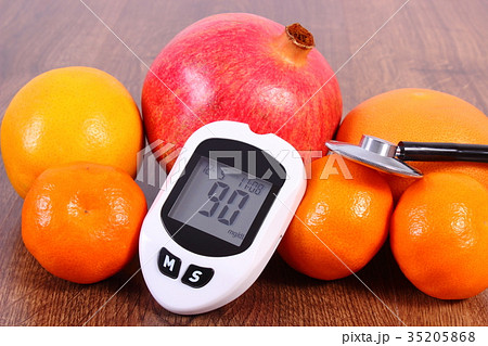 Glucometer, stethoscope and fresh fruits Glucometer, stethoscope and fresh fruits 35205868