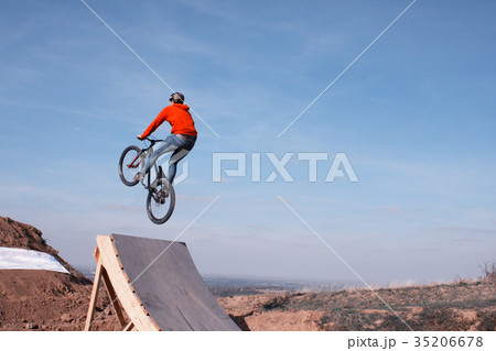 man in sportswear jumping high on mountain bike man in sportswear jumping high on mountain bike 35206678