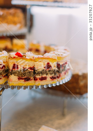 Close-up view of the delicious cake with cherries Close-up view of the delicious cake with cherries 35207627