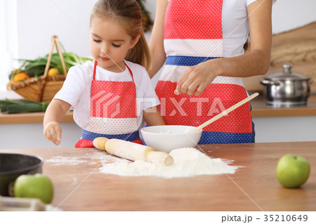 Happy family in the kitchen. Mother and child 35210649