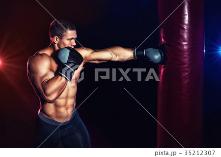 man boxing punching bag 35212307