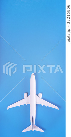 Model of passenger plane on blue background 35215906