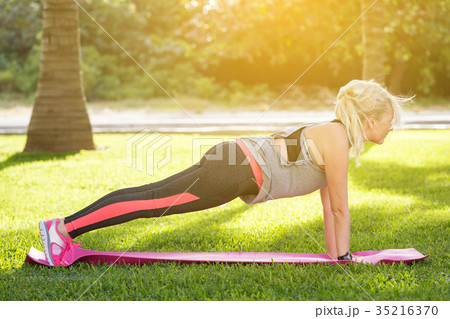 Young fitness woman doing plank position 35216370