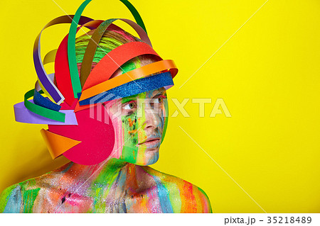 Model with colorful makeup in multicolored helmet Model with colorful makeup in multicolored helmet 35218489