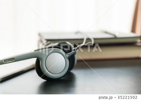 Headphones with book and mobile phone 35221502
