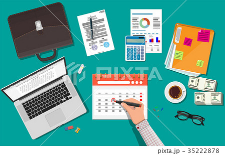 Paper spiral wall calendar. Hand with pen 35222878