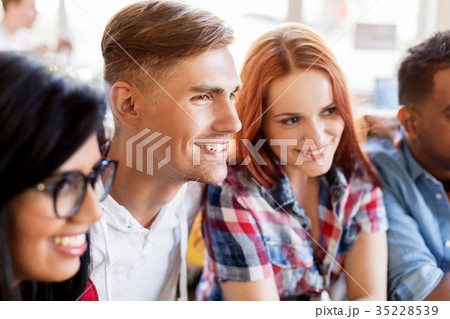 happy friends at restaurant 35228539