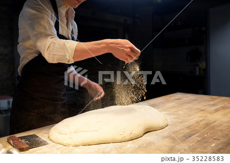 chef or baker making bread dough at bakery chef or baker making bread dough at bakery 35228583