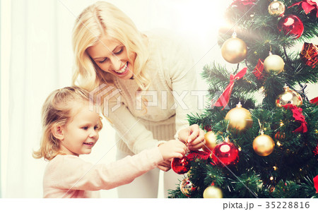 happy family decorating christmas tree at home happy family decorating christmas tree at home 35228816