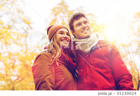 happy young couple walking in autumn park 35230024