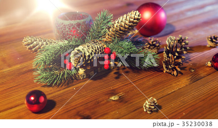 christmas fir branch decoration and candle lantern 35230038