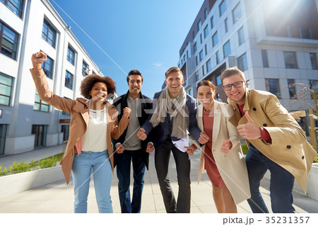 group of people showing thumbs up in city 35231357