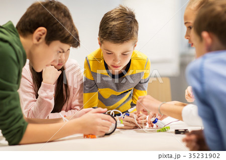 happy children building robots at robotics school happy children building robots at robotics school 35231902