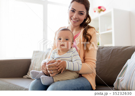 happy young mother with little baby at home 35232630