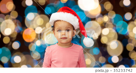 little baby girl in santa hat at christmas little baby girl in santa hat at christmas 35233742