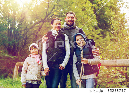 happy family with backpacks hiking 35233757