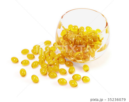 yellow fish oil capsules in glass bowl 35236079