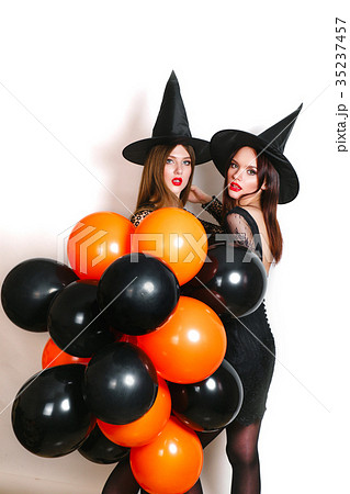 Two happy sexy women in black witch halloween 35237457