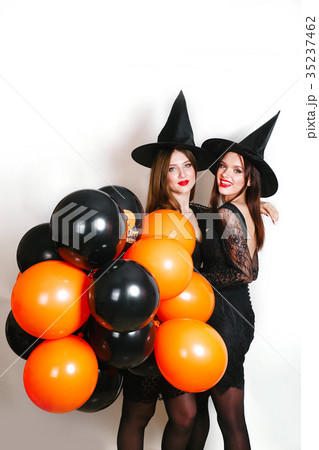 Two happy sexy women in black witch halloween 35237462