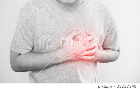 a man touching his heart, hear disease concept a man touching his heart, hear disease concept 35237549