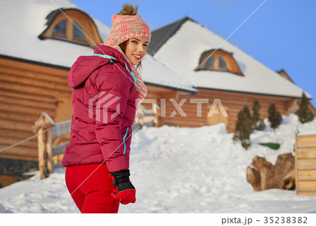 winter, leisure, sport and people concept - happy young woman in winter, leisure, sport and people concept - happy young woman in 35238382