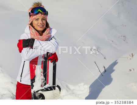 Sexy snowboarder woman outdoors. Winter resort 35238384
