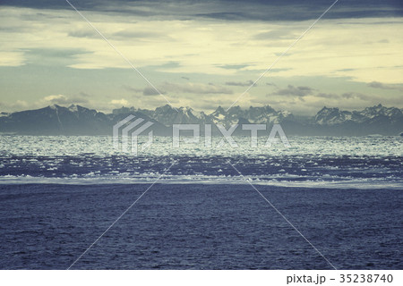 Sunrise over Greenland. High mountain range Sunrise over Greenland. High mountain range 35238740