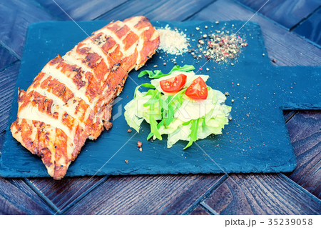 Grilled turkey fillet and vegetables in restaurant 35239058