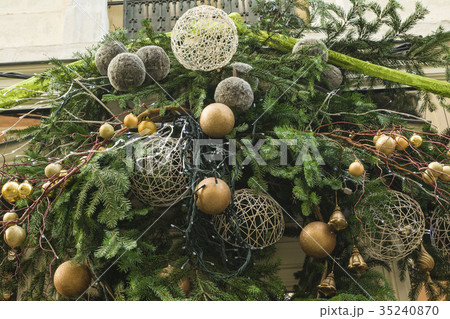 Decoration made from fir branches and golden balls 35240870