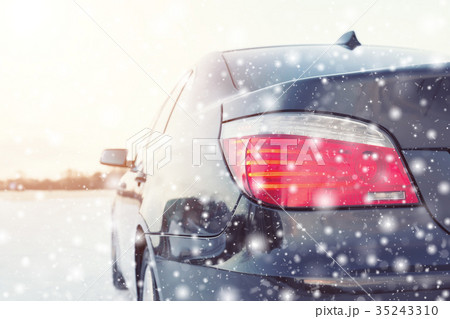 Close up of car tires on the winter road 35243310