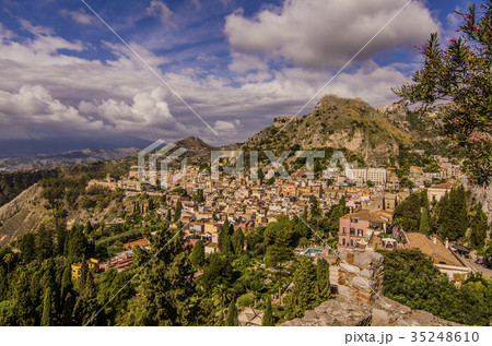 view of city of Taormina from its Greek theatre view of city of Taormina from its Greek theatre 35248610