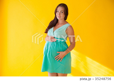 a pregnant woman before childbirth yellow 35248756