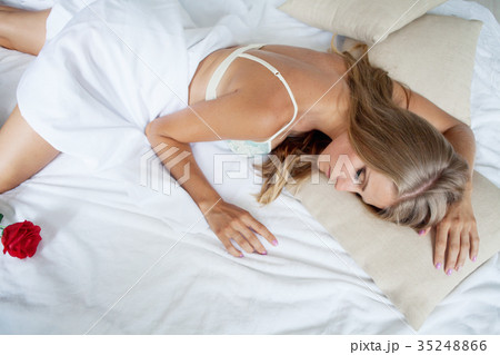 blonde girl in lingerie is asleep in bed blonde girl in lingerie is asleep in bed 35248866