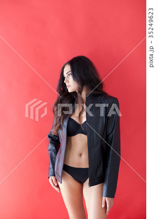brunette girl in leather jacket and black lingerie 35249623