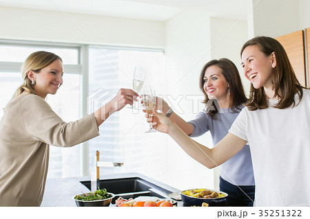 Happy young women toasting with champagne Happy young women toasting with champagne 35251322