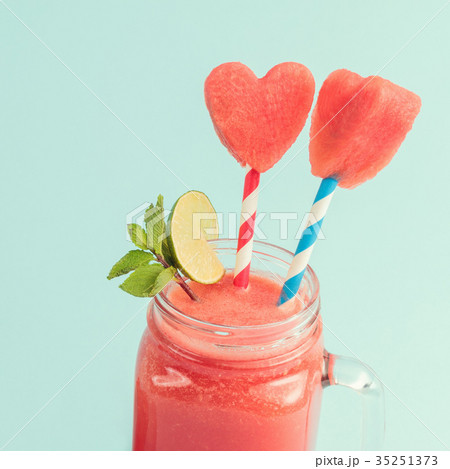 Closeup of watermelon smoothie in Mason jar with 35251373