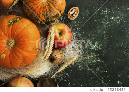 Autumn harvest - pumpkins, apples, nuts, wheat 35258423