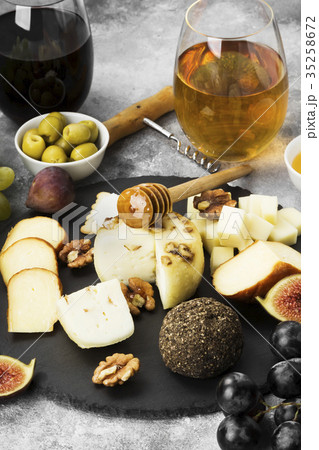 Snacks with wine - various types of cheeses, figs Snacks with wine - various types of cheeses, figs 35258672