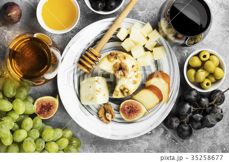 Snacks with wine - various types of cheeses, figs 35258677