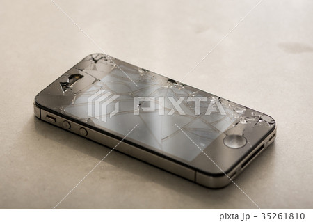 Black smartphone with crashed lcd touch screen Black smartphone with crashed lcd touch screen 35261810