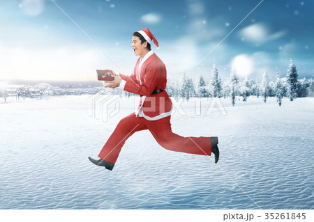 Happy asian man wearing santa claus costume 35261845