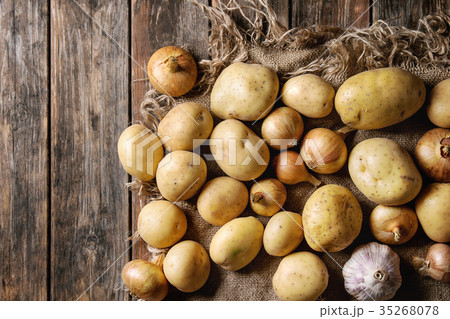 Raw organic potatoes and onion 35268078