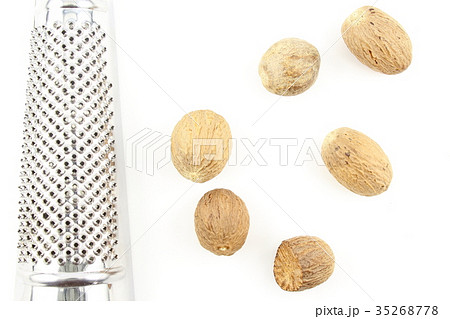 nutmeg seeds isolated on a white background nutmeg seeds isolated on a white background 35268778