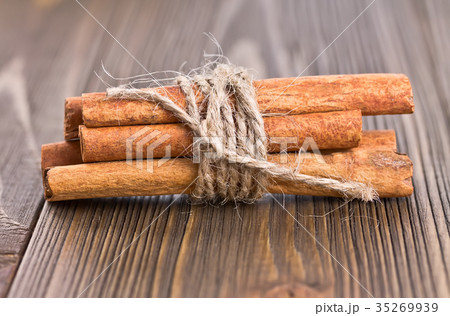 some cinnamon sticks tied with twine some cinnamon sticks tied with twine 35269939