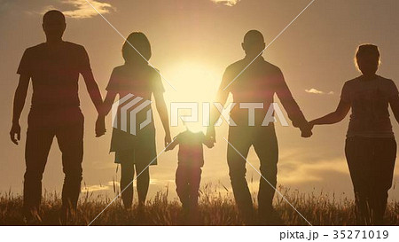 Happy young family with children running around Happy young family with children running around 35271019