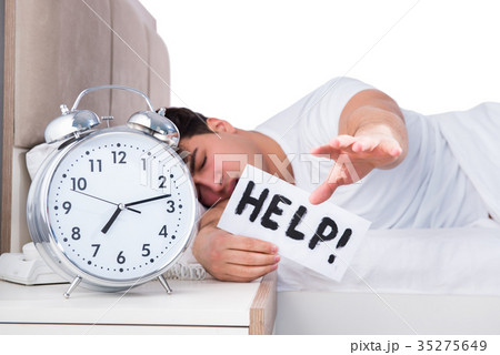 Man in bed suffering from insomnia Man in bed suffering from insomnia 35275649