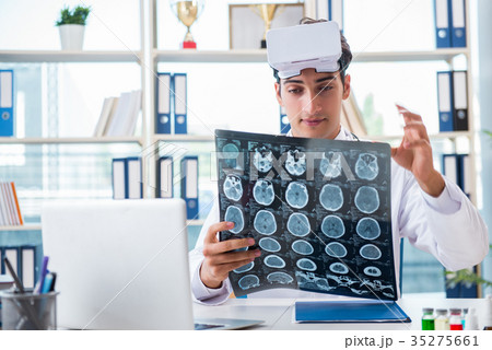 Doctor working with virtual VR reality glasses 35275661